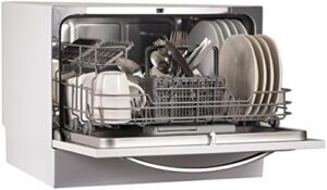 BLACK+DECKER BCD6W Dishwasher on a countertop with clean dishes and a modern kitchen background