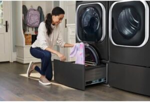 9.0 cu. ft. Mega Capacity Smart Wi-Fi Enabled Front Load Electric Dryer with TurboSteam™ and Built-In Intelligence in a modern laundry room